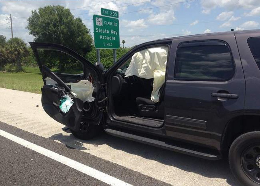 Sarasota County Deputy Chris Butler was making a traffic stop Sunday for a move-over violation when a vehicle hit his driver's side door as it opened.
