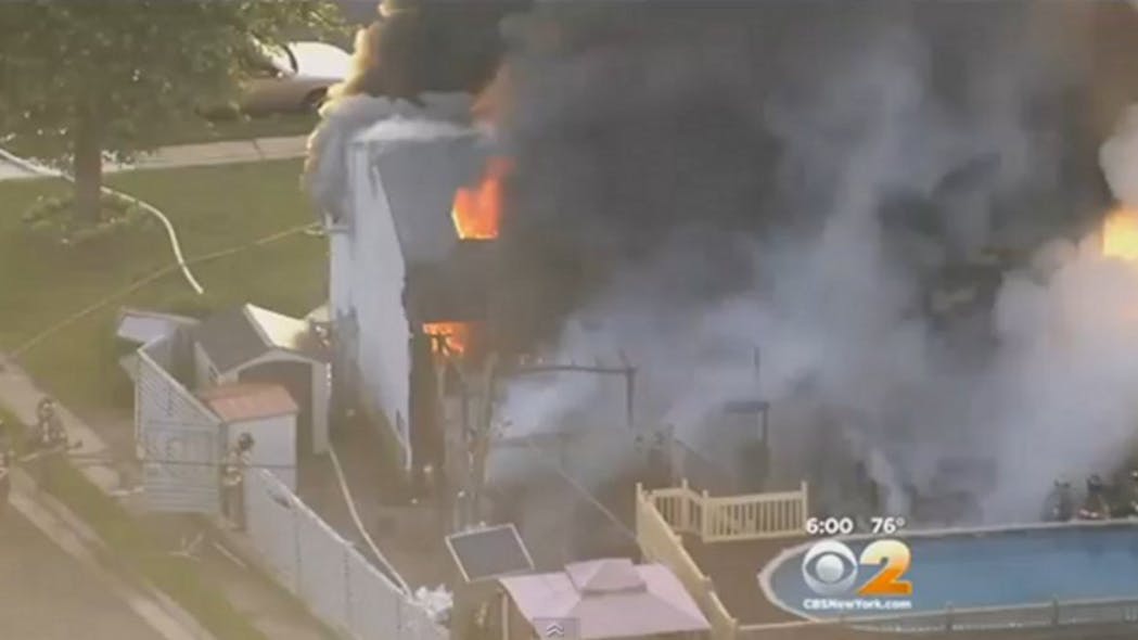 Woodbridge Police Dispatcher Eric Senialkevgch rescued two neighbors from a house fire early Monday morning.