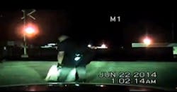 Richmond Police Officer Ramon Morales rescued a woman who was sitting on railroad tracks in the path of an oncoming train Sunday.