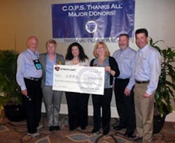 Streamlight representatives present a check to C.O.P.S. Executive Director Dianne Bernhard (second from left) and Madeline Neumann, National President (fourth from left) during National Police Week, May 11-17. Streamlight representatives present a check to C.O.P.S. Executive Director Dianne Bernhard (second from left) and Madeline Neumann, National President (fourth from left) during National Police Week, May 11-17.