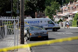A woman walks past a crime scene where police discovered a man who had been shot and subsequently died, in the Bronx section of New York on June 30. A woman walks past a crime scene where police discovered a man who had been shot and subsequently died, in the Bronx section of New York on June 30.