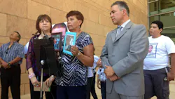 Jose Antonio Elena Rodriguez's grandmother, Taide Elena, displays pictures of her grandson at a news conference on July 29. Jose Antonio Elena Rodriguez's grandmother, Taide Elena, displays pictures of her grandson at a news conference on July 29.