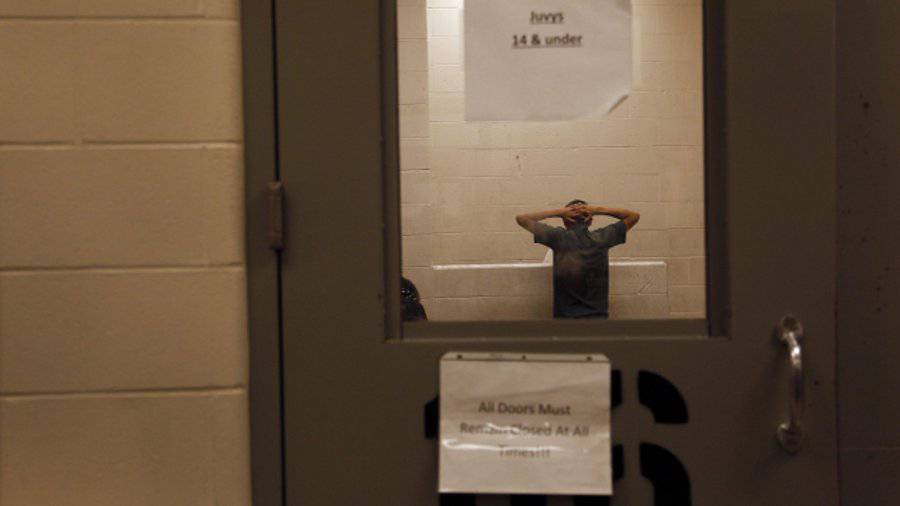 Immigrants who have been caught crossing the border illegally are housed inside the McAllen Border Patrol Station in McAllen, Texas, where they are processed on July 15.
