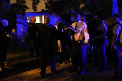 A resident vents his frustration to police investigating the shooting of his niece during a backyard cookout on the 109th block of South Throop Street early July 7. A resident vents his frustration to police investigating the shooting of his niece during a backyard cookout on the 109th block of South Throop Street early July 7.