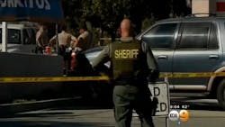 Law enforcement officers were searching Moreno Valley late Tuesday for one or two suspects after a deputy responding to an assault-with-a-deadly weapon call was injured.