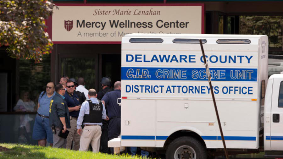 Investigators work the scene of a shooting on July 24 at Mercy Fitzgerald Hospital in Darby, Pa.