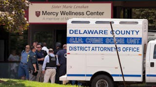 Investigators work the scene of a shooting on July 24 at Mercy Fitzgerald Hospital in Darby, Pa.