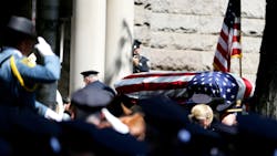 A casket containing the body of Jersey City Police Department officer Melvin Santiago enters St. Aloysius Church during a funeral procession on July 18. A casket containing the body of Jersey City Police Department officer Melvin Santiago enters St. Aloysius Church during a funeral procession on July 18.