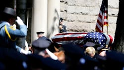 A casket containing the body of Jersey City Police Department officer Melvin Santiago enters St. Aloysius Church during a funeral procession on July 18.