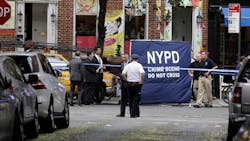 Police officers stand near a crime scene on July 28 in New York.