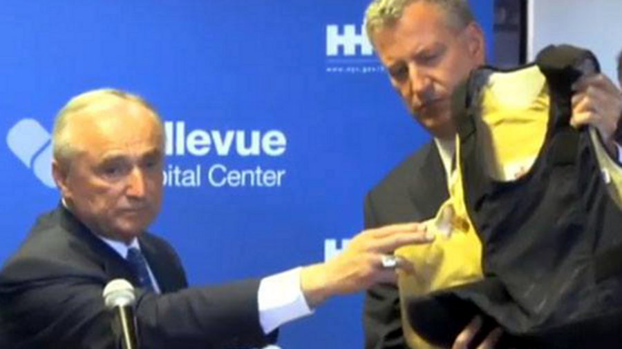 NYPD Commissioner William Bratton says that Detective Mario Muniz was shot in his upper-right chest area, but that it was stopped by his bulletproof vest.