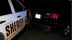 A woman was arrested early Saturday after she rammed a car, causing it to strike a sheriff's office patrol vehicle and pin a deputy. A woman was arrested early Saturday after she rammed a car, causing it to strike a sheriff's office patrol vehicle and pin a deputy.
