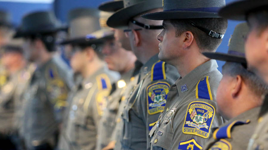 Connecticut State line up before a ceremony honoring responders to the Sandy Hook Elementary School shooting on July 8.