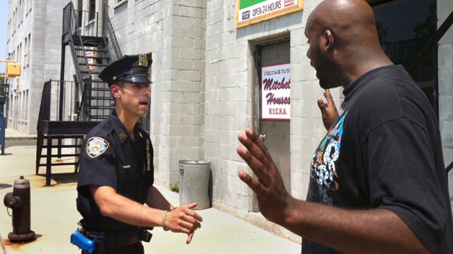 NYPD Det. Anthony Mannuzza, left, and Police Officer Robert Martin, right, simulate a street stop during a training session at a training facility.