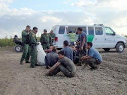 Border Patrol agents detain immigrants who crossed from Mexico into the United States near McAllen on June 27. Border Patrol agents detain immigrants who crossed from Mexico into the United States near McAllen on June 27.