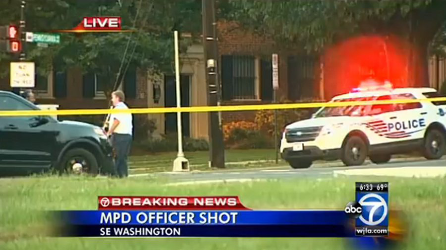 One suspect arrested and two were being sought after an off-duty D.C. detective was wounded Wednesday.