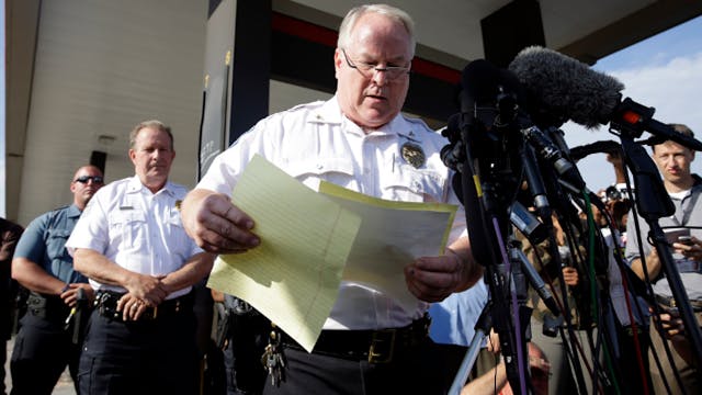 Ferguson Police Chief Thomas Jackson releases the name of the the officer accused of fatally shooting Michael Brown, an unarmed black teenager, on Aug. 15.