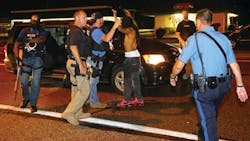 A protester is arrested while walking down the street on West Florissant Avenue on a relatively peaceful night on Aug. 20 in Ferguson, Mo. A protester is arrested while walking down the street on West Florissant Avenue on a relatively peaceful night on Aug. 20 in Ferguson, Mo.