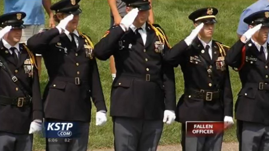 Officers in uniform by the thousands joined other mourners Wednesday and filled the sanctuary and the grounds outside a West St. Paul church to remember fallen Mendota Heights Police Officer Scott Patrick.