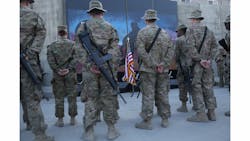 U.S. service members stand in front of a U.S. flag during a ceremony on the thirteenth anniversary of the 9/11 terrorist attacks in front of the World Trade Center Memorial at Bagram Airfield, Afghanistan on Sept. 11. U.S. service members stand in front of a U.S. flag during a ceremony on the thirteenth anniversary of the 9/11 terrorist attacks in front of the World Trade Center Memorial at Bagram Airfield, Afghanistan on Sept. 11.
