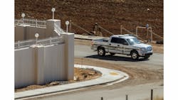 A Marshal with the FLDS Hildale/Colorado City Town Marshals patrols along the walls of a compound built for imprisoned leader Warren Jeffs in Hildale, Utah.