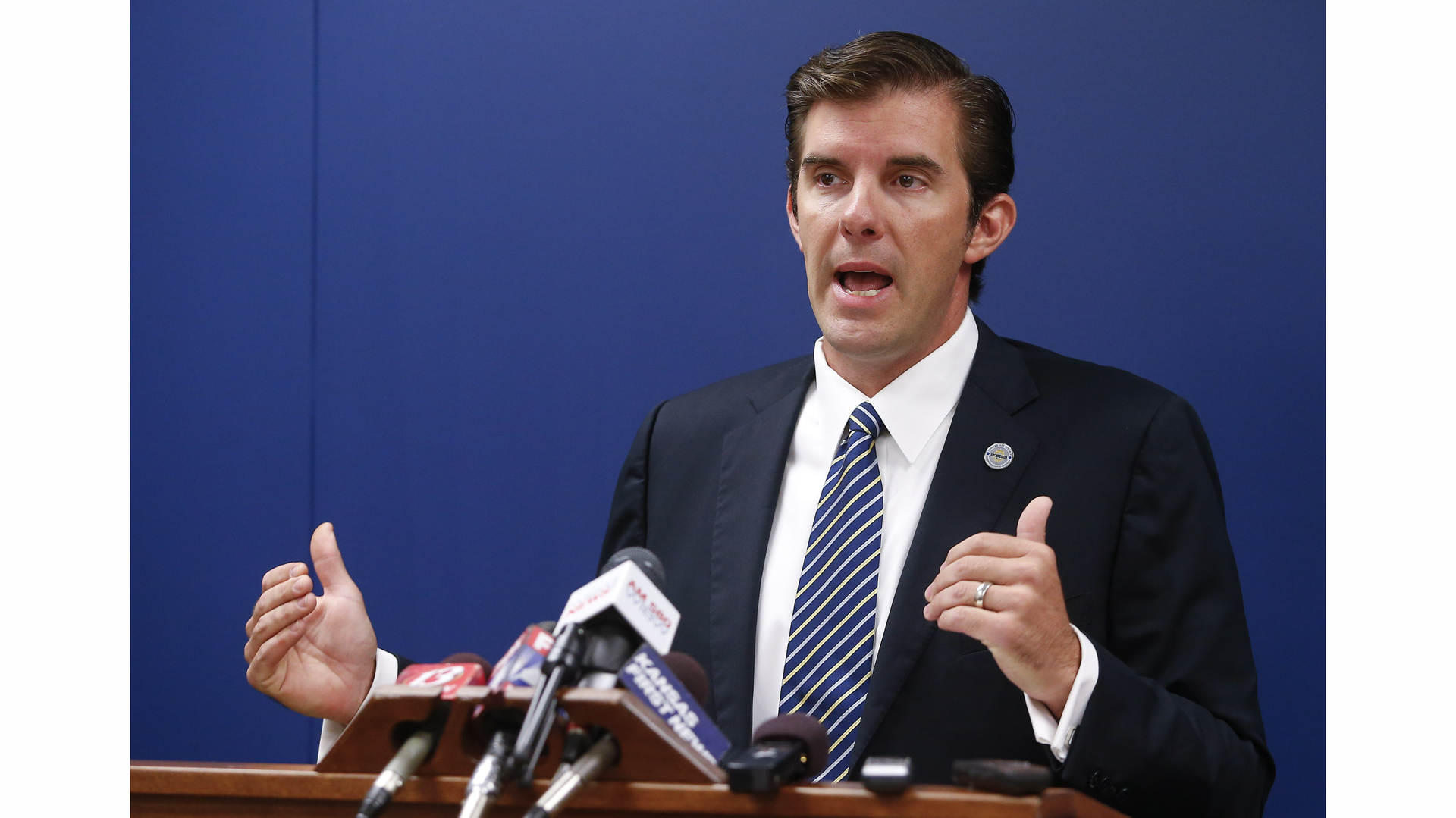 Shawnee County District Attorney Chad Taylor outlines the charges that were filed against the two defendants in the slaying of a Topeka police officer during a news conference on Sept. 10.