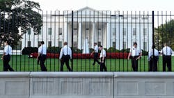 Uniformed Secret Service officers walk along the fence on the North side of the White House in Washington on Sept. 20. Uniformed Secret Service officers walk along the fence on the North side of the White House in Washington on Sept. 20.
