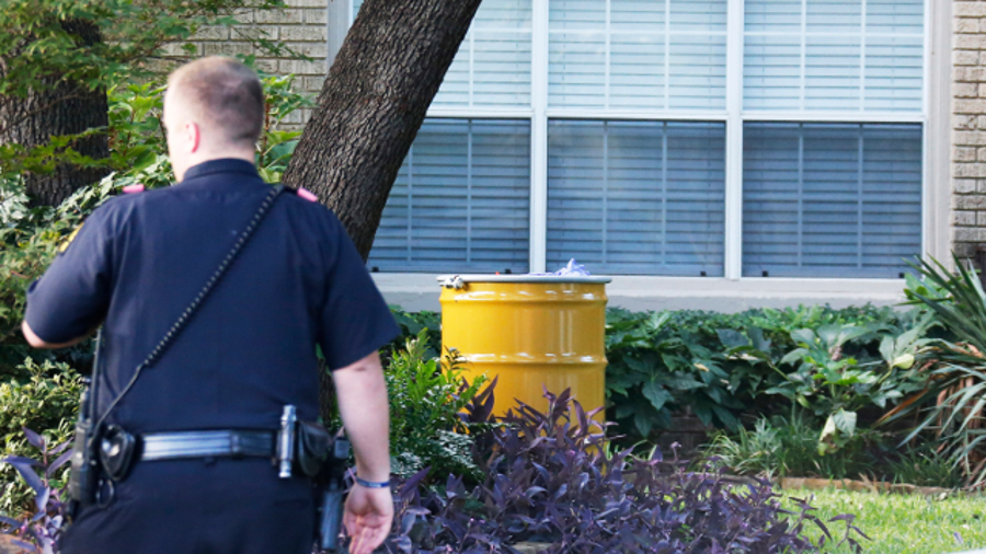A barrel for disposal of hazardous waste sits outside the residence of a nurse diagnosed with Ebola on Oct. 12 in Dallas.