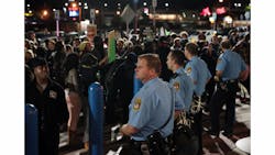 'Mr. Walmart, get on the phone with Bo McCullough to tell him to step down,' a protester says over the loud speaker shouting at a police line standing in front of the Bridgeton, Mo., Walmart Supercenter on Oct. 14. 'Mr. Walmart, get on the phone with Bo McCullough to tell him to step down,' a protester says over the loud speaker shouting at a police line standing in front of the Bridgeton, Mo., Walmart Supercenter on Oct. 14.