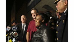 Police officials surround Keisha Gaither, second from right, mother of kidnapping victim Carlesha Freeland-Gaither, following a news conference in Philadelphia on Nov. 5. Police officials surround Keisha Gaither, second from right, mother of kidnapping victim Carlesha Freeland-Gaither, following a news conference in Philadelphia on Nov. 5.