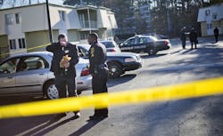gaofficershot 548b238b1bc5c Police investigate the scene of an apartment complex where authorities say two officers were shot leading to a neighborhood search for the suspected gunman on Dec. 12. gaofficershot 548b238b1bc5c Police investigate the scene of an apartment complex where authorities say two officers were shot leading to a neighborhood search for the suspected gunman on Dec. 12.