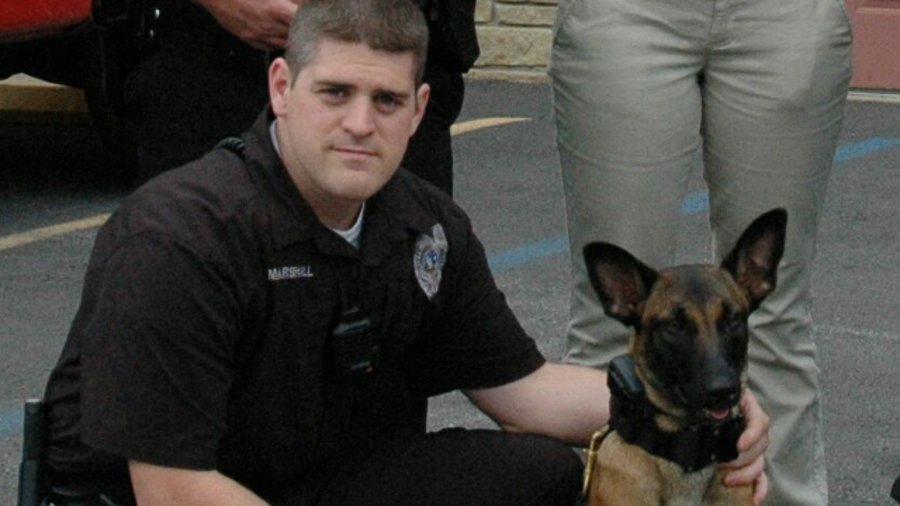 Officer Lance Marshall, left, and K-9 Fritzi
