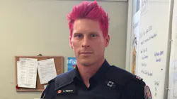 Officer Luke Wilson had his blond hair dyed hot pink in support of the International Day of Pink. Officer Luke Wilson had his blond hair dyed hot pink in support of the International Day of Pink.