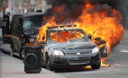 A Maryland Transit Authority patrol car burns at North and Pennsylvania Avenues on April 27 in Baltimore.