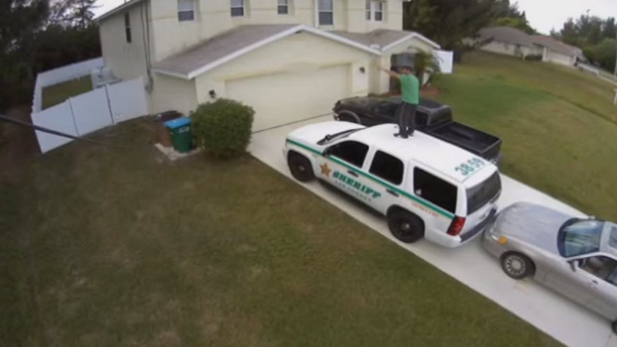 Christian Radecki bumped his car into the rear of the marked patrol vehicle and proceeded to dance on its roof.