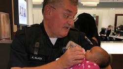 Overland Park Police Officer Andy Black was helping a mother at a mall who had just had a seizure. Overland Park Police Officer Andy Black was helping a mother at a mall who had just had a seizure.
