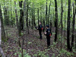 Corrections officers walk through woods while searching for two prison escapees from Clinton Correctional Facility in Dannemora on June 23 in Owls Head, N.Y. Corrections officers walk through woods while searching for two prison escapees from Clinton Correctional Facility in Dannemora on June 23 in Owls Head, N.Y.