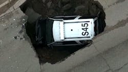 Sheridan Police Sgt. Grege Miller was on patrol early Friday morning when the road gave way, causing his SUV to fall in. Sheridan Police Sgt. Grege Miller was on patrol early Friday morning when the road gave way, causing his SUV to fall in.