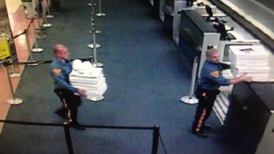 Two troopers ordered and paid for more than a dozen pizzas after weather stranded passengers in an airport.