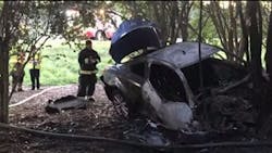 Trooper Sean Duckers knocked out the window of a burning vehicle to save an unconscious man on Monday. Trooper Sean Duckers knocked out the window of a burning vehicle to save an unconscious man on Monday.