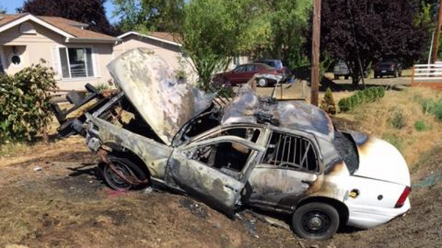 Polk County Sheriff's Deputy Shon Latty's patrol car caught fire after colliding with another vehicle Saturday.