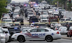 Police vehicles are seen near the Washington Navy Yard in Washington on July 2. Police vehicles are seen near the Washington Navy Yard in Washington on July 2.