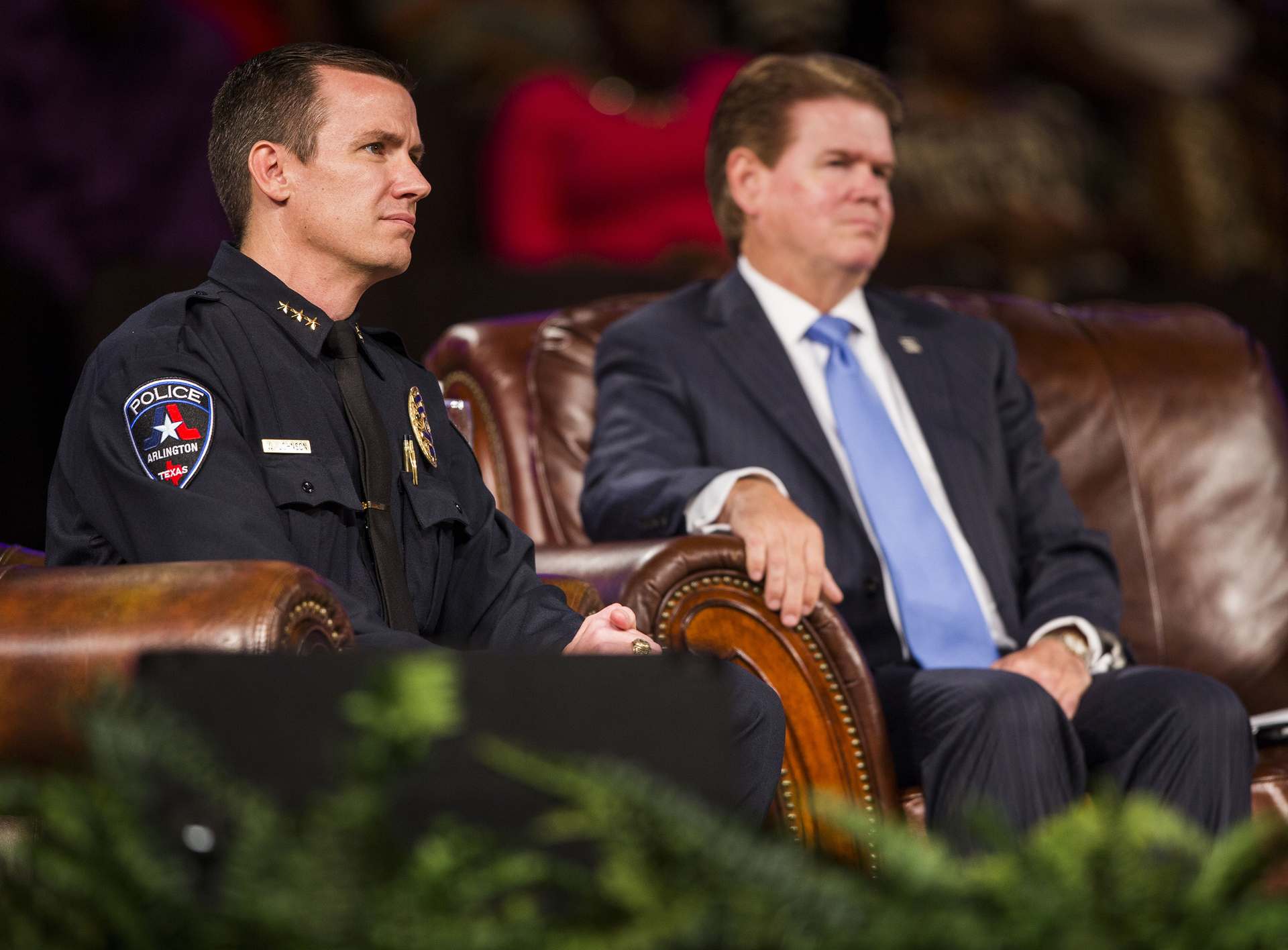Arlington police chief Will Johnson, left, and Arlington mayor Jeff Williams listen to proceedings at a 'Unity, Peace and Prayer Rally' at Cornerstone Baptist Church in Arlington, Texas on Aug. 12 for Christian Taylor.