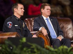 Arlington police chief Will Johnson, left, and Arlington mayor Jeff Williams listen to proceedings at a 'Unity, Peace and Prayer Rally' at Cornerstone Baptist Church in Arlington, Texas on Aug. 12 for Christian Taylor. Arlington police chief Will Johnson, left, and Arlington mayor Jeff Williams listen to proceedings at a 'Unity, Peace and Prayer Rally' at Cornerstone Baptist Church in Arlington, Texas on Aug. 12 for Christian Taylor.