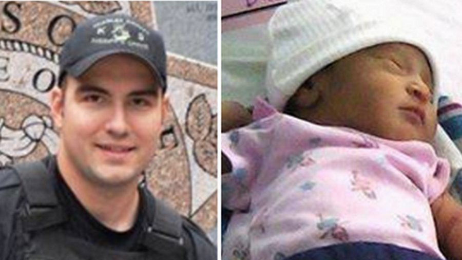 K-9 Officer Darin Behm, left, and newborn baby Dana