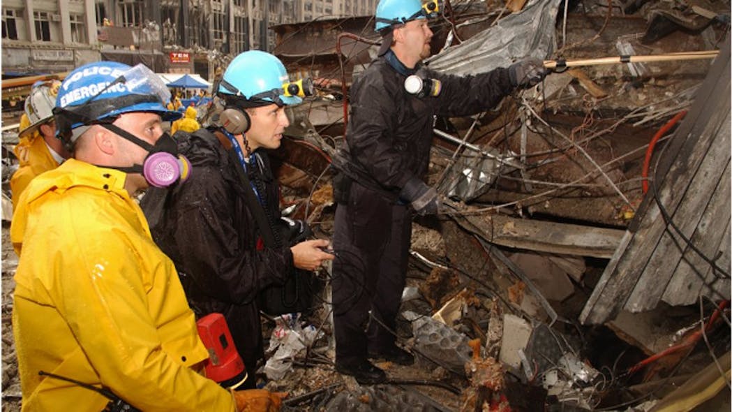 Members of the NYPD continue to search for survivors amongst the wreckage of the World Trade Center on September 20, 2001.