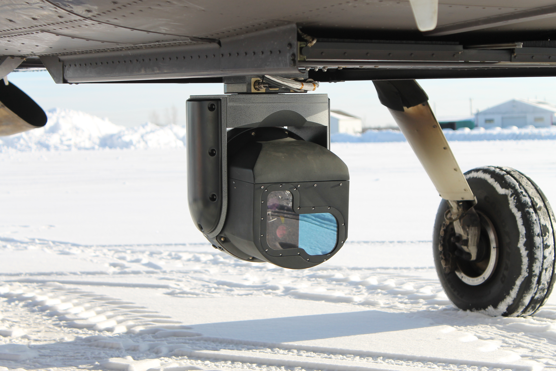 The Harris CorvusEye 1500 turret can be seen under the nose of a DA-42 aircraft belonging to Vigilance B.V. at the Bonn-Hangelar Airport in Germany. U.S.-based Harris Corp. (formerly Exelis) employees showcased the capabilities of the CorvusEye 1500 Wide Area Motion Imagery (WAMI) system at the airport July 8 and 9. Several dozen representatives from German military and law enforcement civil agencies attended the presentations, which were the first of several that Harris plans to conduct in Europe this year