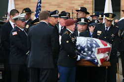 Covered in an American flag, the casket of slain Fox Lake police Lt. Charles Joseph Gliniewicz arrives at Antioch Community High School on Sept. 7. Covered in an American flag, the casket of slain Fox Lake police Lt. Charles Joseph Gliniewicz arrives at Antioch Community High School on Sept. 7.