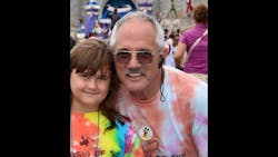 Okaloosa County Deputy Bill Myers, right, and his granddaughter Abby are seen together at Disney World.