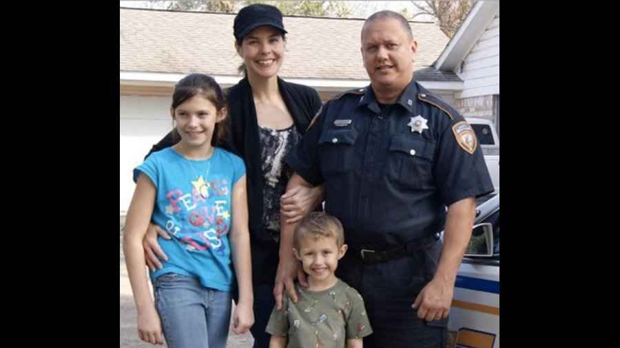 Harris County Sheriff's Deputy Darren Goforth, right, poses for a photo with his family.